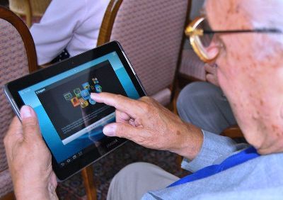 Featured is a photo of a senior citizen taking advantage of the latest in Tablet Technology.  He's not going to be left out of the fun!  Photo by Dutch photographer Sigismund von Dobschutz ... used courtesy of Creative Commons Attribution-Share Alike 3.0 Unported License.